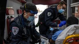 YONKERS, NEW YORK - APRIL 14: (EDITORIAL USE ONLY) Empress EMTs take a patient with COVID-19 symptoms to the hospital on April 14, 2020 in Yonkers, Westchester County, New York. Located adjacent to New York City, Westchester County is part of the epicenter of the coronavirus pandemic in the United States. (Photo by John Moore/Getty Images)