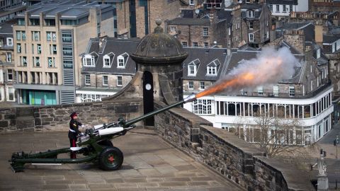 Sgt. David Beveridge fires a gun salute from the ramparts of Scotland's Edinburgh Castle.