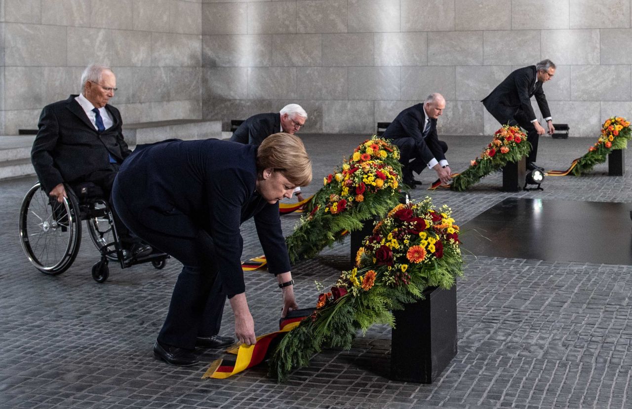 German Chancellor Angela Merkel attends a wreath-laying ceremony at the Neue Wache Memorial in Berlin.