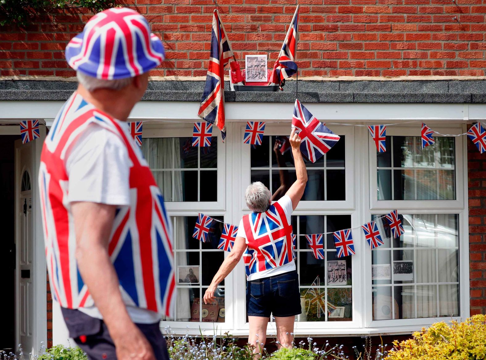 Graham and Sue Gillson put finishing touches on their home decorations in Hartley Wintney, England.