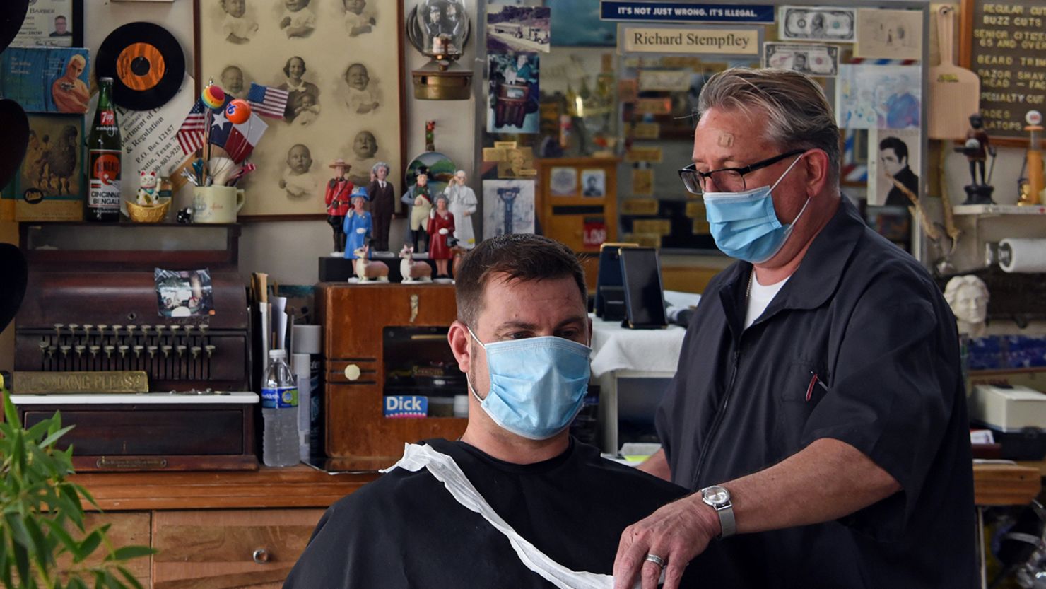 A man receives a haircut at Doug's Barber Shop in Houston on May 8 after social distancing guidelines were relaxed at some businesses.