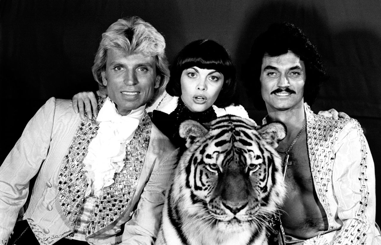 Fischbacher and Horn pose with French singer Mireille Mathieu in 1977. The two men met aboard the TS Bremen cruise ship in 1957, where Fischbacher was working as a steward and entertainer. He enlisted Horn, the captain's bellboy, to assist during his nightly magic show.