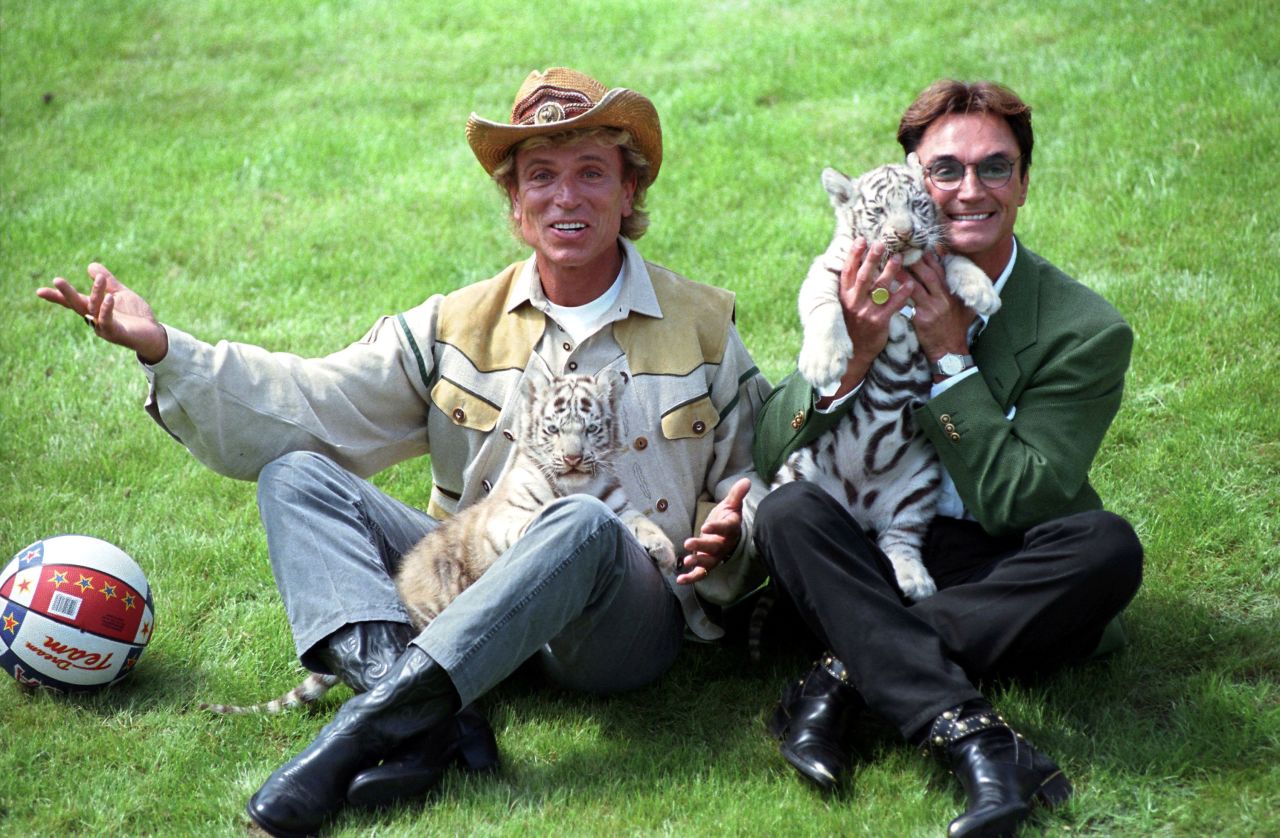 Fischbacher and Horn play with a white tiger at a park in Stuckenbrock, Germany, in 1997. <br />