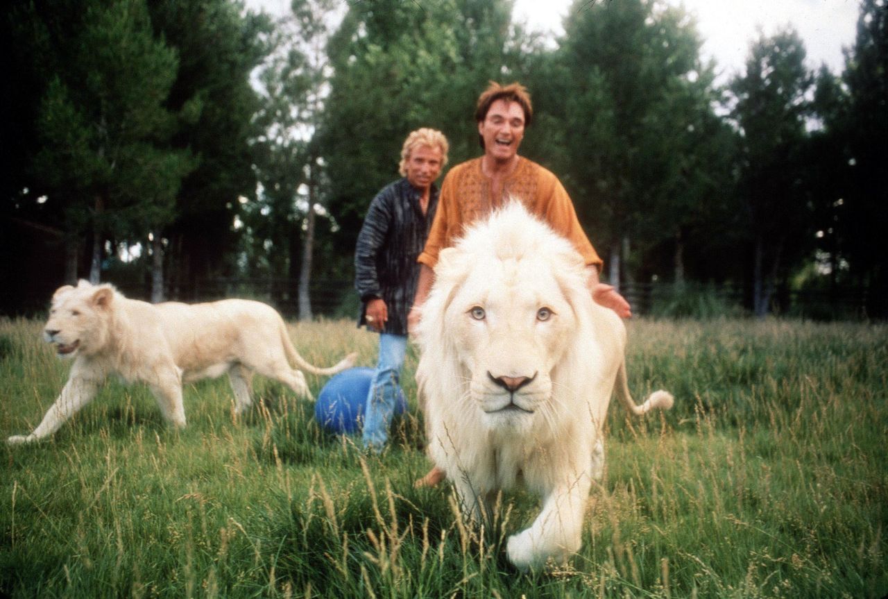 The duo is pictured with two of their lions in 1999. <br />