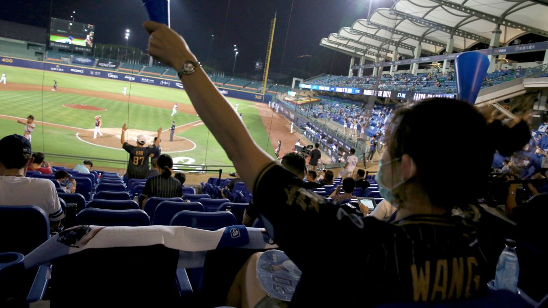Fans cheer during a professional baseball game between the Fubon Guardians and the Uni-President Lions in New Taipei City, Taiwan, on May 8.