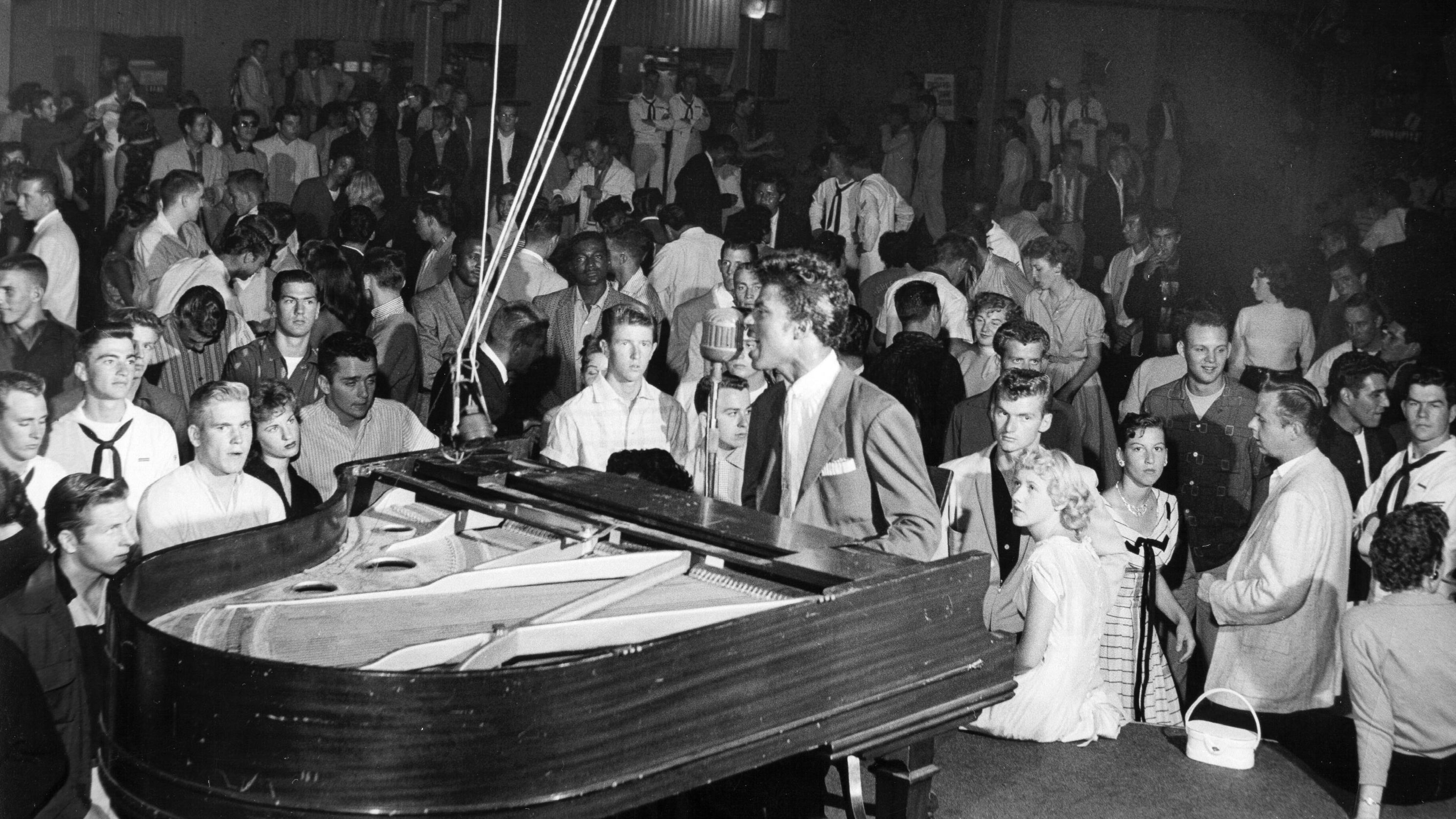 Little Richard performs on stage in 1955.