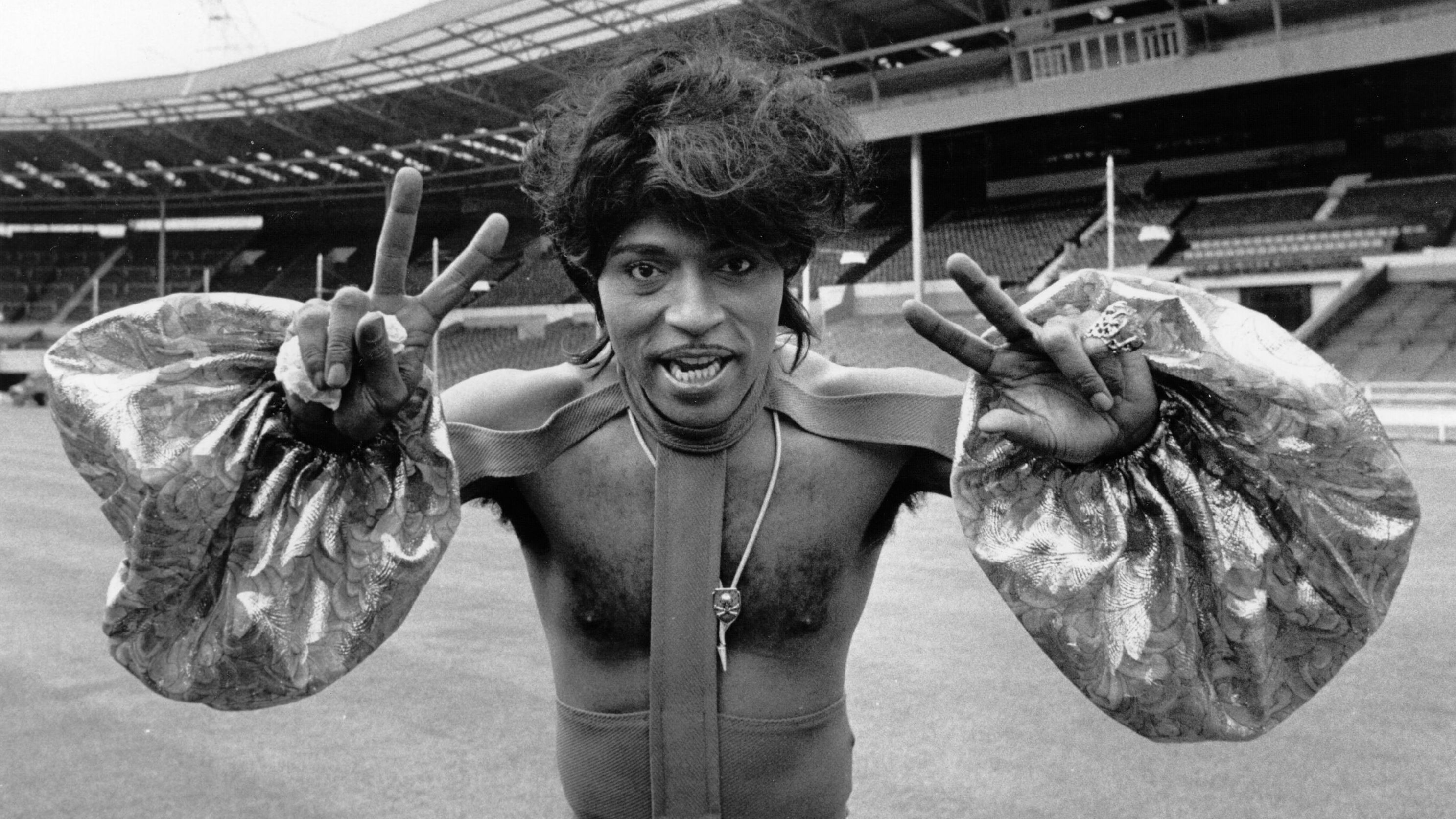 Little Richard poses in costume at an empty Wembley Stadium in London during rehearsals for a concert in 1972.