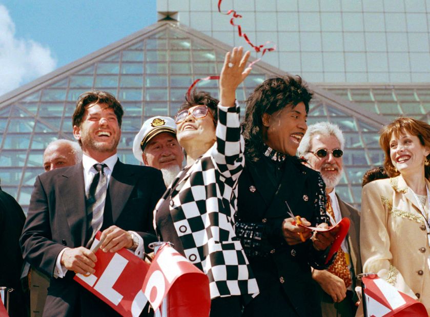 Rolling Stone publisher Jann Wenner, left, Yoko Ono, center, and Little Richard celebrate after cutting the ribbon to open the Rock and Roll Hall of Fame and museum in Cleveland in 1995.