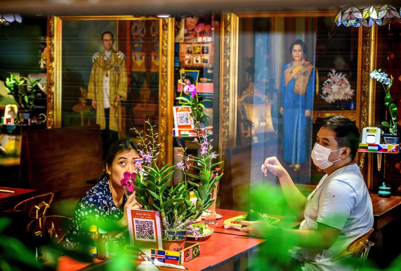Patrons eat at a restaurant in Bangkok, Thailand, on May 9.