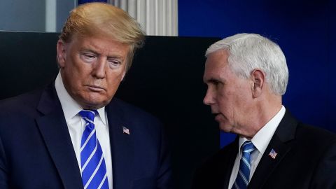 US President Donald Trump and Vice President Mike Pence confer at a daily briefing of the coronavirus task force at the White House on April 23, 2020 in Washington, DC.