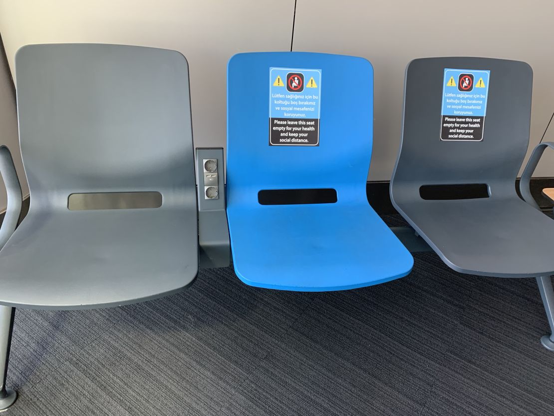 Social distancing was encouraged at Istanbul's airport with signs on seats,