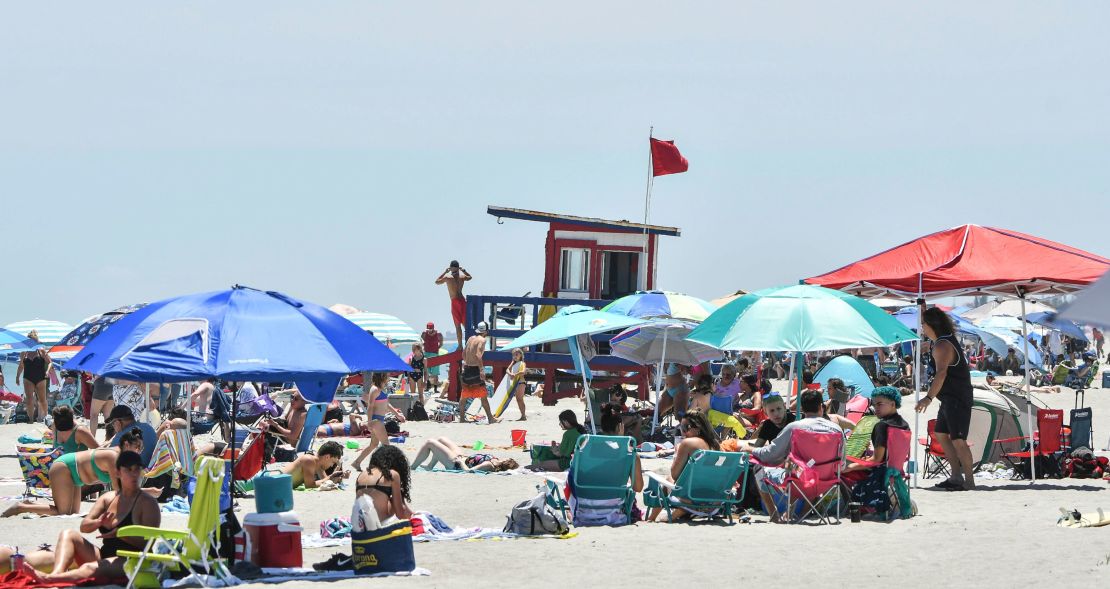 People enjoy the sun and sand at Lori Wilson Park in Cocoa Beach Saturday, May 2, 2020 after the park reopened to visitors.