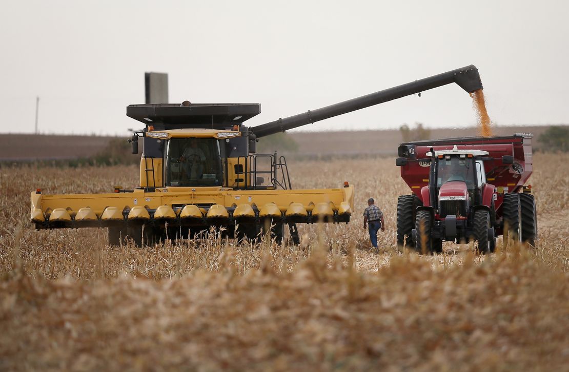 Workers harvesting a field of corn in South Dakota.