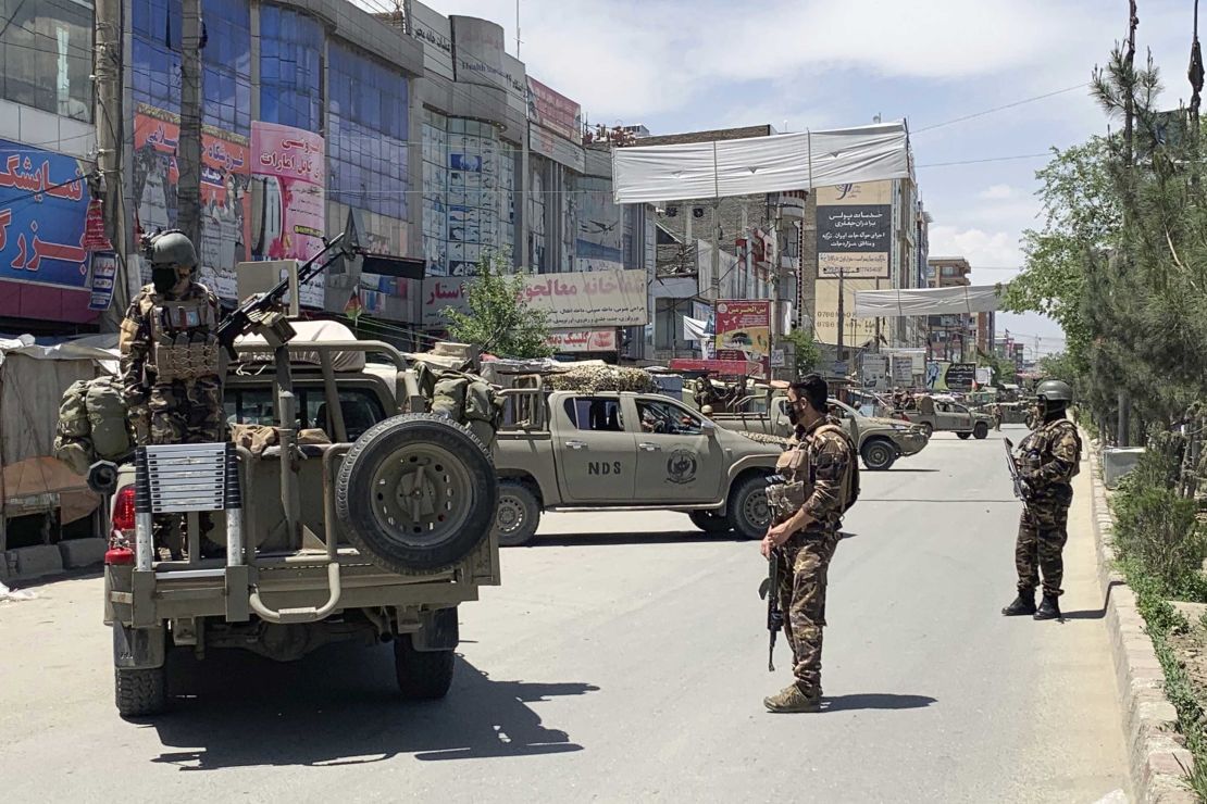 Afghan security personnel arrive at the site of the attack on the west side of the Afghan capital.