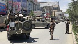 Afghan security personnel arrive at the site where gunmen attacked, in Kabul, Afghanistan, Tuesday, May 12, 2020. Gunmen stormed a hospital in the western part of the Afghan capital on Tuesday, setting off a gun battle with the police, officials said. (AP Photo/Rahmat Gul)