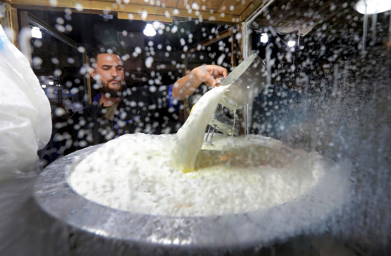 A man sells a yogurt drink in a popular market area in Erbil, Iraq, on May 11. 