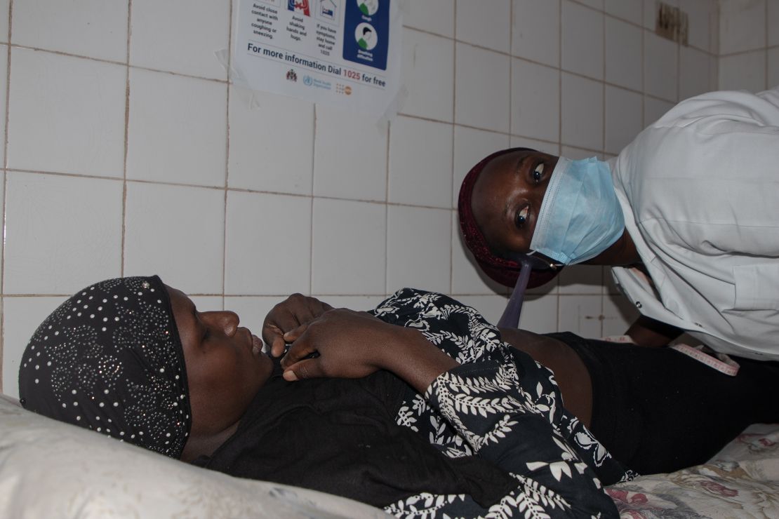 Midwife Fatou Joof examines a woman  at the Serrekunda Health Centre.