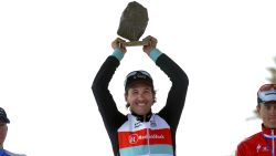 Switzerland's Fabian Cancellara (Radioschack team) holds his trophy, next to Belgium's Sep Vanmarcke (L) (Blanco team) and Netherlands' Niki Terpstra (Omega team), after winning the 111th edition of the Paris-Roubaix one-day classic cycling race, on April 7, 2013, in Roubaix, northern France. Cancelllara won the prestigious race for the third time. The winner from 2006 and 2010 took the gruelling 254km "Queen of the Classics" race ahead of Vanmarcke and Terpstra. AFP PHOTO / FRANCOIS LO PRESTI        (Photo credit should read FRANCOIS LO PRESTI/AFP via Getty Images)