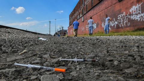 Partially used needles lie along rail tracks where addicts use drugs in Huntington, West Virginia. 