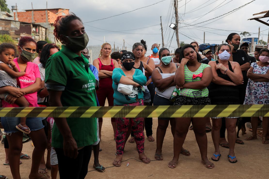 Residents wait for food donations organized by NGO Kapadocia Institute for poor families from Capadocia Slum at Brasilandia district amid the coronavirus disease (COVID-19) outbreak, in Sao Paulo, Brazil, May 1, 2020.