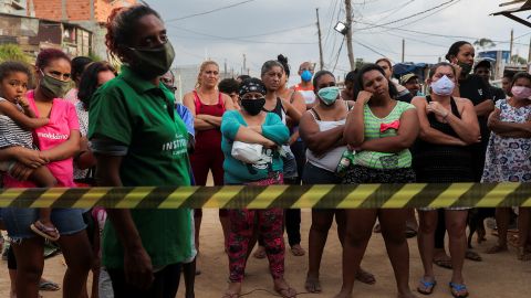 Residents wait for food donations organized by NGO Kapadocia Institute for poor families from Capadocia Slum at Brasilandia district amid the coronavirus disease (COVID-19) outbreak, in Sao Paulo, Brazil, May 1, 2020.