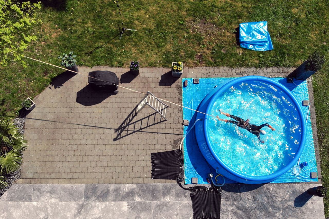 Triathlete Jelle Geens works out in an inflatable swimming pool in Heusden-Zolder, Belgium, on May 4.