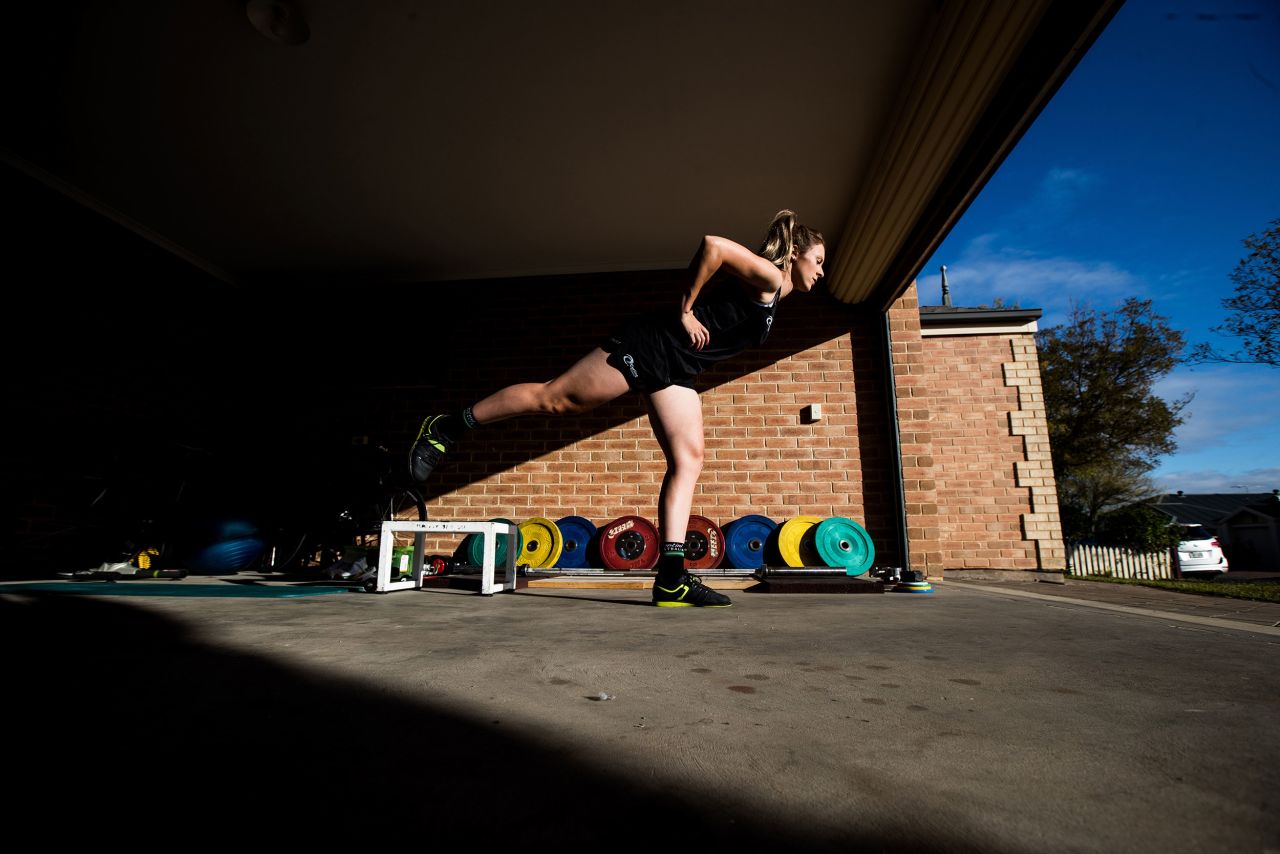 Cyclist Annette Edmondson works out at her home in Adelaide, Australia, on April 17.