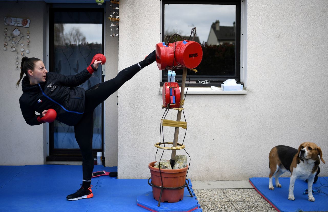 Alexandra Recchia, a five-time karate world champion, trains in the garden of her house in L'Hay-les-Roses, France, on April 3.