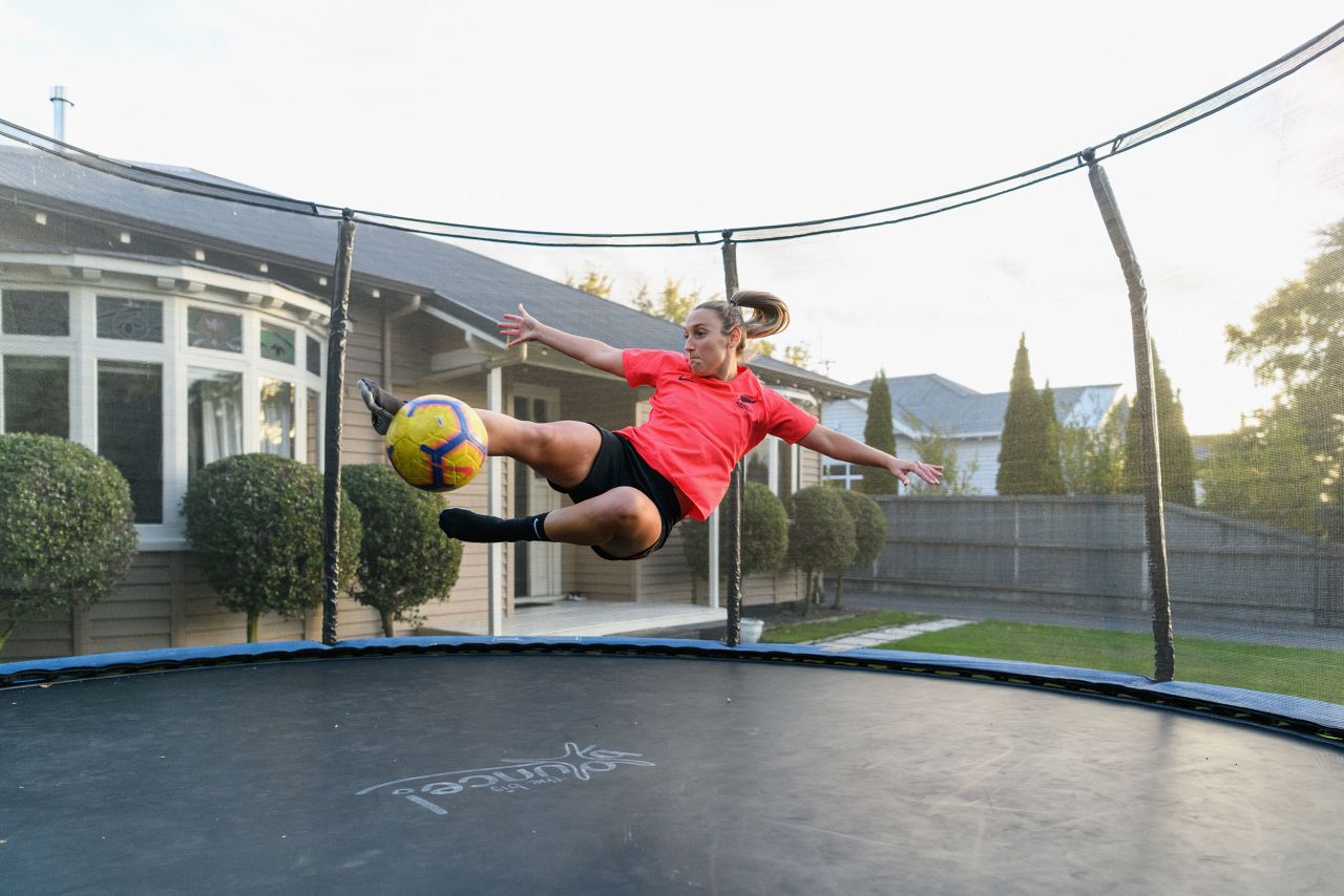 Soccer player Annalie Longo uses a trampoline to practice in Christchurch, New Zealand, on April 8.