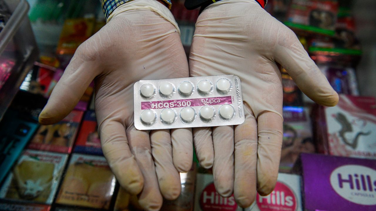 A vendor displays hydroxychloroquine (HCQ) tablets at a pharmacy in New Delhi.