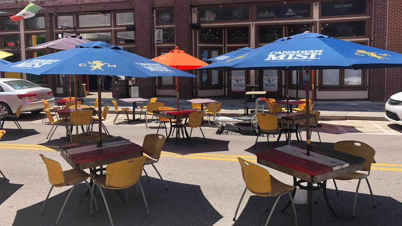 Tampa Bay is allowing some restaurants to place tables in the street so the businesses can remain viable during social distancing. Barricades are placed around the outdoor seating that's now located in the street.