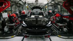 FREMONT, CA - JULY 26: Robotics arms install the front seats to the Tesla Model 3 at the Tesla factory in Fremont, California, on Thursday, July 26, 2018. (Photo by Mason Trinca for The Washington Post via Getty Images)