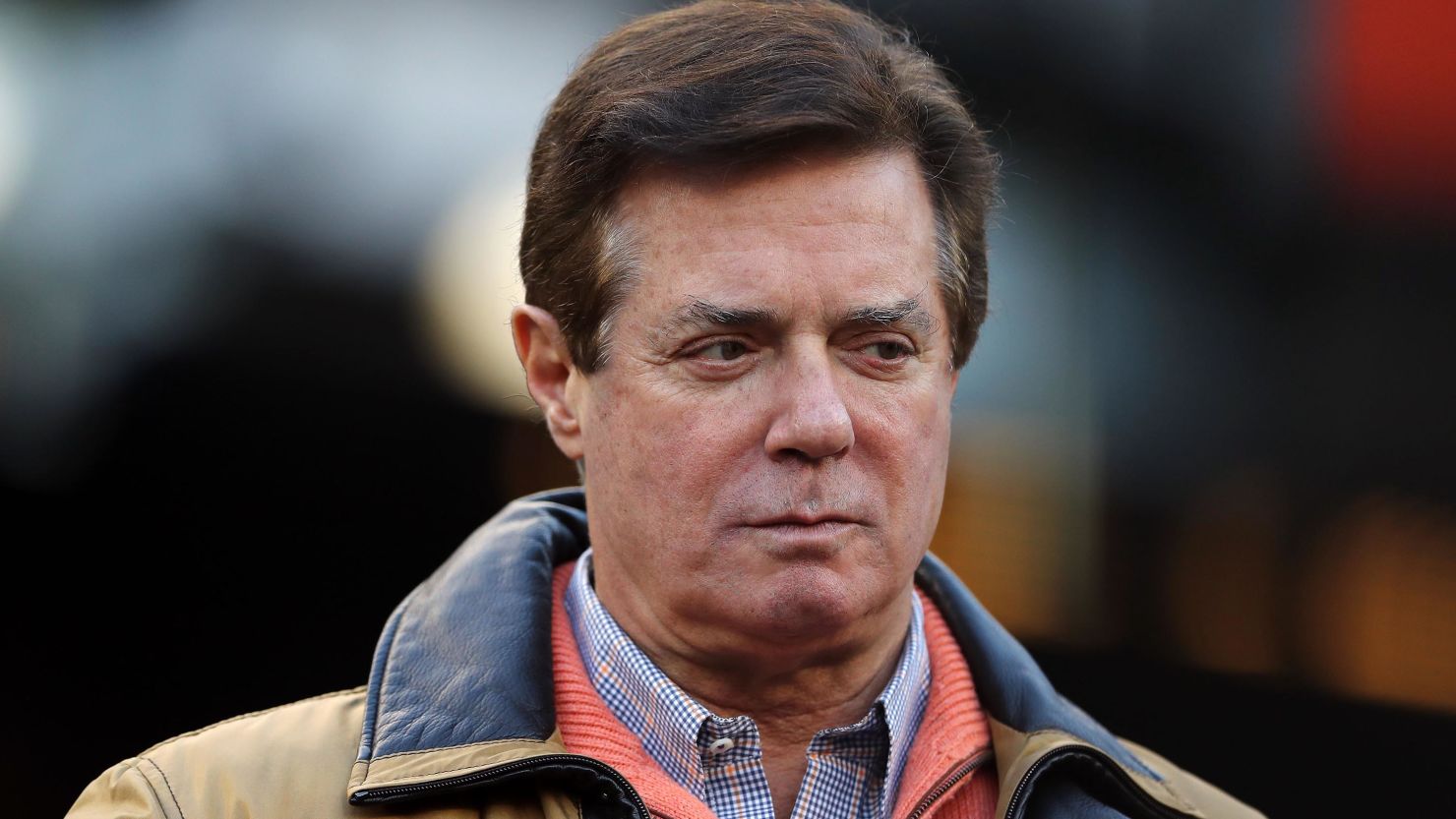 Former Donald Trump presidential campaign manager Paul Manafort looks on during Game Four of the American League Championship Series at Yankee Stadium on October 17, 2017 in the Bronx borough of New York City. 