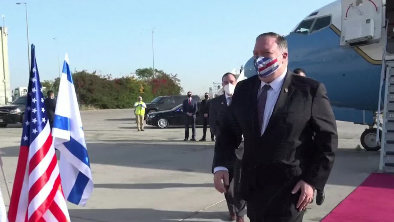 Mike Pompeo wears a face mask with the US flag's colors on it as he arrives in Jerusalem.