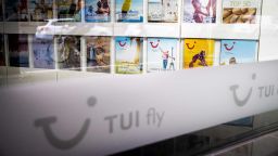 A picture taken on May 13, 2020 through a window shows travel brochures inside a closed branch of the travel firm TUI in Berlin amid the Covid-19 corona virus pandemic. - Tui, the worlds largets travel operator said it would be reopening selected hotels in Germany "in the coming days", with its operations in other European destinations also ready to welcome holidaymakers, but announced that up to 8,000 jobs would go as it strives to cut costs by 30% in a major restructuring despite being bolstered by a 1.8bn state-backed loan in Germany. (Photo by Odd ANDERSEN / AFP) (Photo by ODD ANDERSEN/AFP via Getty Images)