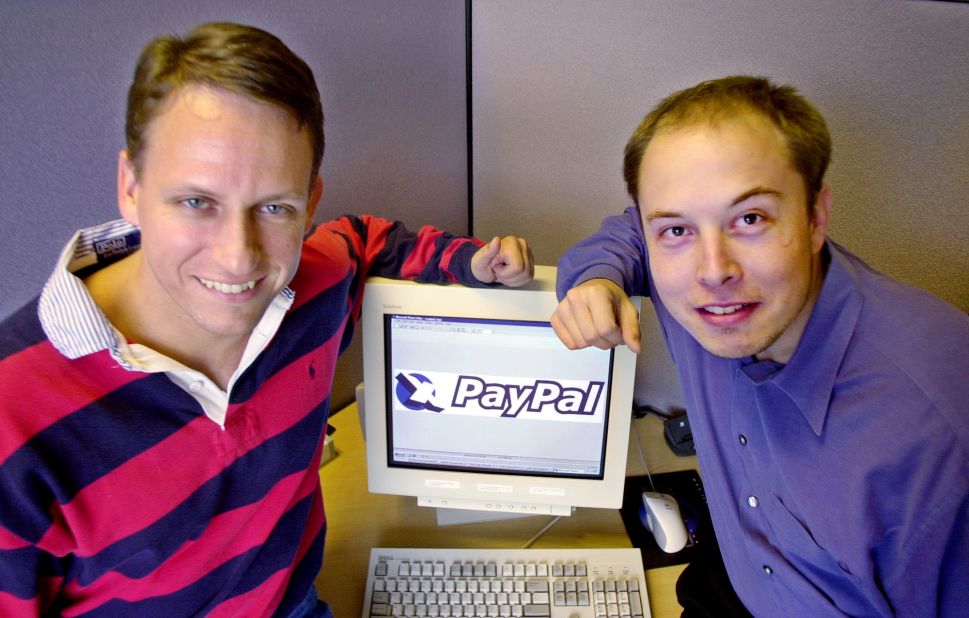 PayPal CEO Peter Thiel, left, and Musk pose at the company's corporate headquarters in Palo Alto, California, in 2000. Musk had co-founded X.com, an online banking and financial services company. It merged with Continuity in 2000 and was renamed PayPal. The online payment platform was acquired by eBay in a $1.5 billion deal in 2002. Musk pocketed $165 million.