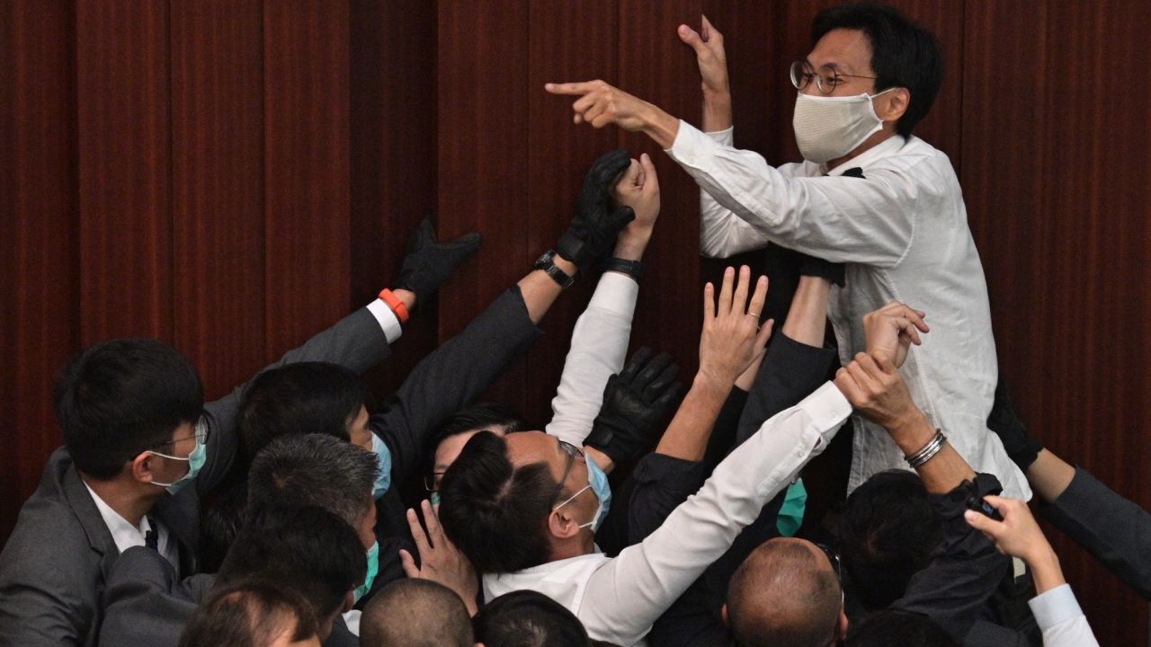Pro-democracy lawmaker Eddie Chu Hoi-dick shouts at security trying to restrain him during an angry Legislative Council session in Hong Kong on May 8, 2020.