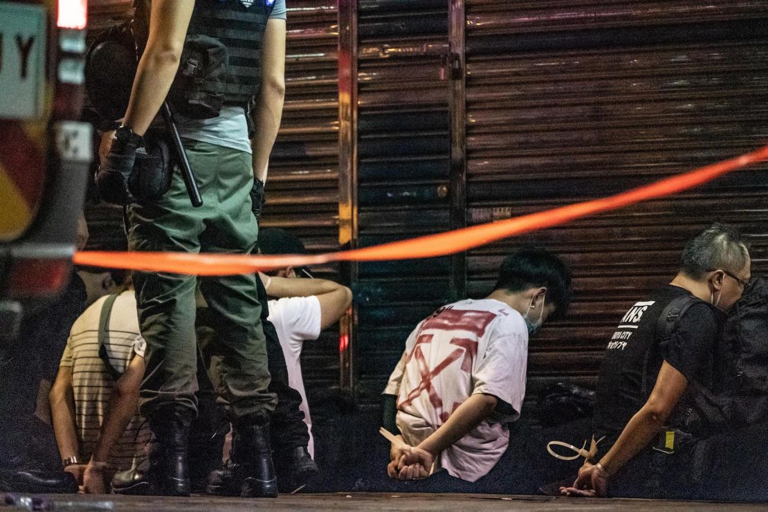 Riot police detain a group of people during an demonstration in Mongkok district on May 10, 2020 in Hong Kong, China.