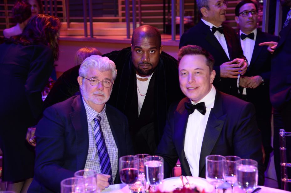 Musk attends the Time 100 Gala with filmmaker George Lucas, left, and rapper Kanye West in 2015.