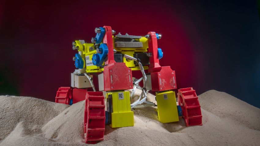 Built with multifunctional appendages able to spin wheels that can also be "wiggled" and lifted, the Mini Rover was modeled on a novel NASA rover design and used in the laboratory to develop and test complex locomotion techniques robust enough to help it climb hills composed of granular material, here ordinary beach sand.