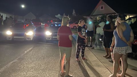 Neighbors and police gather after the group arrived at the Shepards' home in Pender County on May 3.
