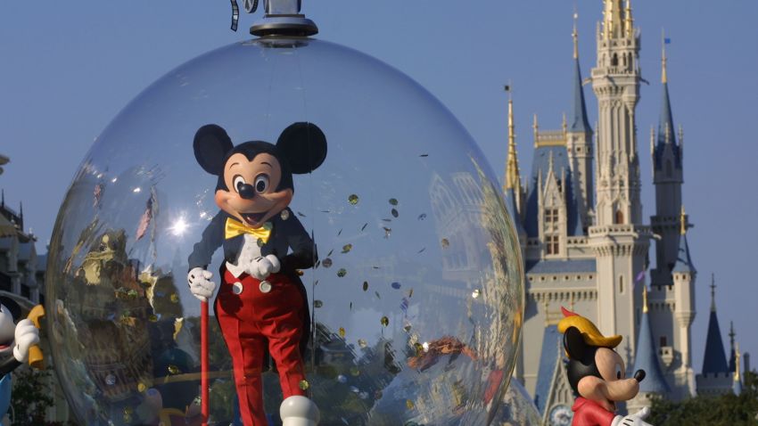 397155 06: Mickey Mouse rides in a parade through Main Street, USA with Cinderella's castle in the background at Disney World's Magic Kingdom November 11, 2001 in Orlando, Florida. (Photo by Joe Raedle/Getty Images)