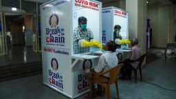 Medical staff collect samples from people at a kiosk to test for Covid-19 in Kerala, India, on April 6, 2020. 