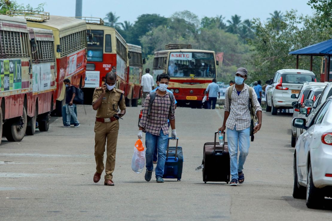 Indian citizens evacuated from Maldives arrive at the Cochin port in Kochi in the south Indian state of Kerala on May 10, 2020. 