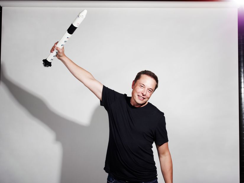 Musk holds up a model rocket in this photo for Bloomberg Businessweek magazine in 2012.