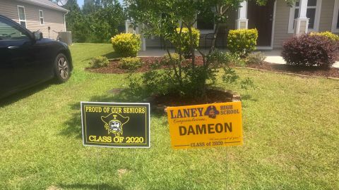 A sign congratulating Dameon Shepard on his high school graduation sits on the family's lawn in May. 