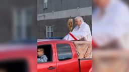 Rev. Nicholas Martorano of St. Nick's Catholic Church rode around two parishes in South Philadelphia on the back of a red pickup to bless people. 