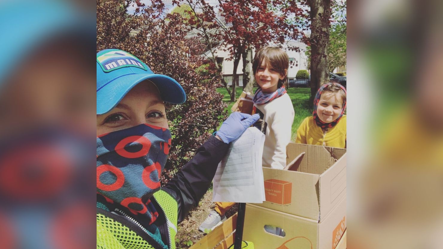 Samantha Block and her children, Levon and Scarlett, were among the dozens of volunteers who helped deliver masks to all the residents of Melrose, Massachusetts, on Tuesday. 