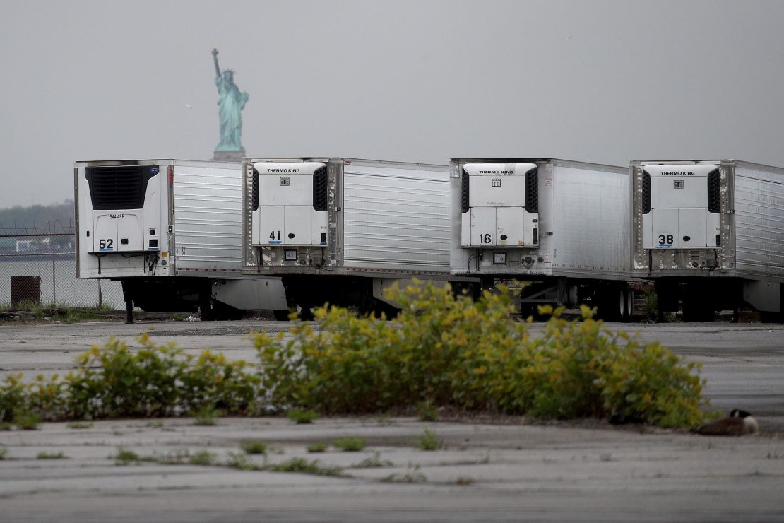 Refrigerated trucks functioning as temporary morgues in New York, which has suffered a devastating outbreak.