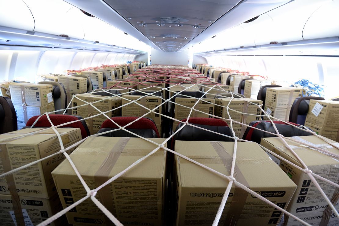 A flight carrying PPE from Malaysia lands in England. Passenger jets as well as cargo planes are being used in order to "ramp up" imports of protective personal equipment.